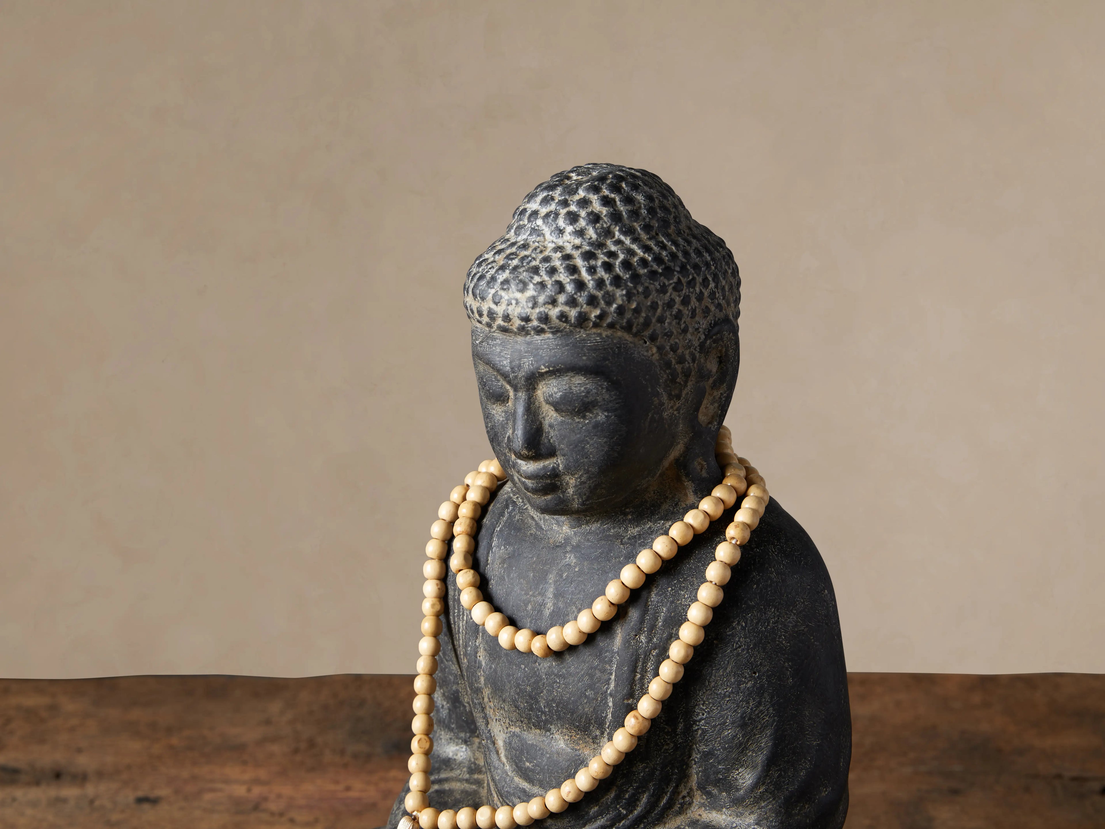 Stone Buddha with Mala Beads